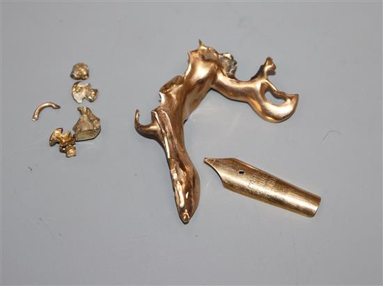 A 14ct gold nib and yellow metal scrap dental pieces, etc.